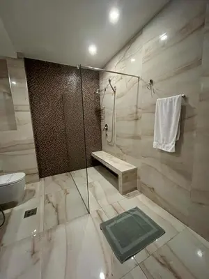 a bathroom with a shower and a sink and a toilet at Budva Gate by In Property in Budva