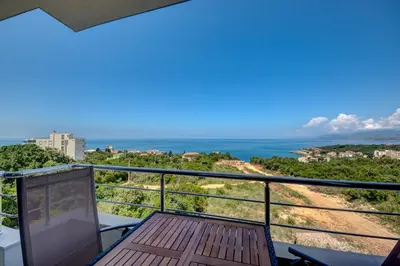 a balcony with a view of the ocean at Jana in Utjeha