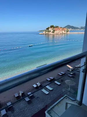 a view of the beach from a hotel window at Beach apartment Sveti Stefan in Sveti Stefan