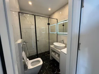 a bathroom with a toilet and a sink at Beach apartment Sveti Stefan in Sveti Stefan
