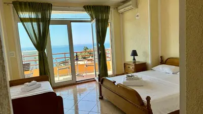 a hotel room with two beds and a balcony at Sea La Vie Apartments in Ulcinj