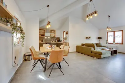 a living room with a table and a couch at Sutorman 2 Villa D&B in Zupci