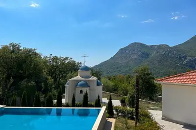 a villa with a chapel and a swimming pool at Sutorman 2 Villa D&B in Zupci