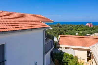 a view of the ocean from the balcony of a building at Sun & Sea in Utjeha