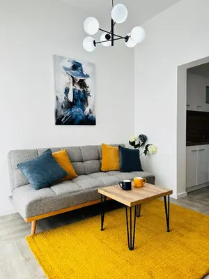 a living room with a couch and a table at Apartment for you in Bar