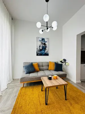 a living room with a couch and a table at Apartment for you in Bar