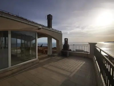 a balcony of a house with a view of the ocean at Villa Anlave in Sveti Stefan