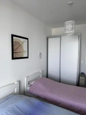 a bedroom with a purple bed and a glass closet at Sarah in Bijela Glavica
