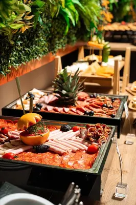 a buffet of different types of food on display at Invictus Hotel in Budva