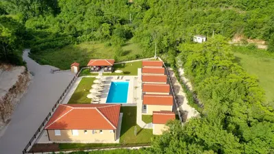 an aerial view of a house with a swimming pool at Etno Selo Grabovicka Jutra in Cetinje