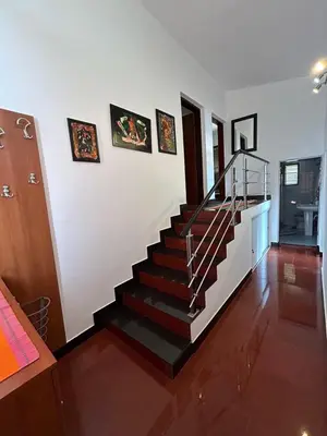 a staircase in a living room with a stair case at Villa Galatea in Utjeha