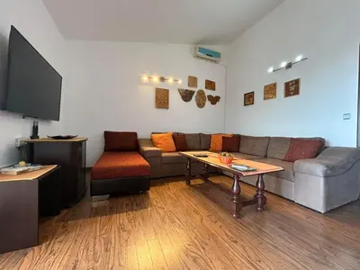 a living room with a couch and a table at Villa Galatea in Utjeha