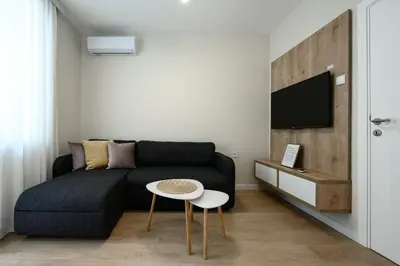 a living room with a couch and a table at Lux Apartment 88 in Kotor