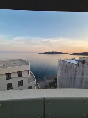 a view of a body of water from a building at Rafailovici Beachfront Apartment in Budva