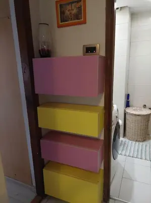 a stack of colorful shelves in a room at Modern 1-bedroom condo with free parking & fast WiFi in Podgorica