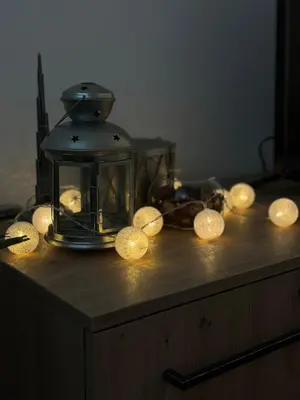 a lantern with lights on top of a table at Eleven in Podgorica
