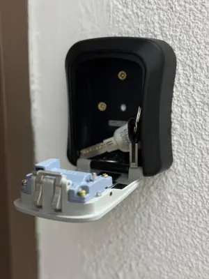 a wall mounted electrical outlet with a screwdriver at Eleven in Podgorica
