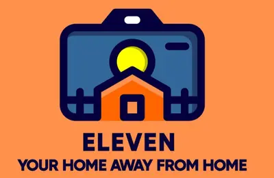 a briefcase with a house in it with the words eleven your home away from at Eleven in Podgorica