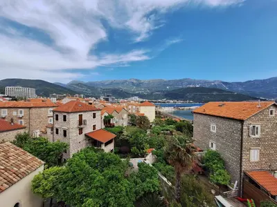 an overview of a city with mountains in the background at Santa Maria - Old Town Apartment in Budva