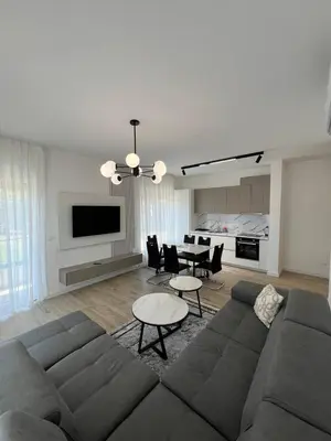 a living room with a couch and a table at Frekuenca Apartments in Ulcinj