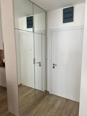 a glass partition in a room with a door at Apartment Veljko Becici in Becici