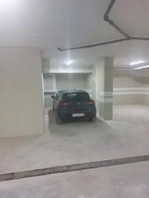 a car parked in an empty parking garage at Apartment Veljko Becici in Becici