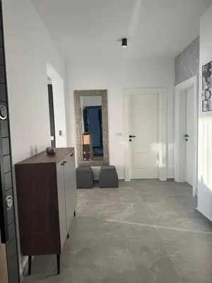 a living room with a dresser and a mirror at Luxury Ocean View in Ulcinj