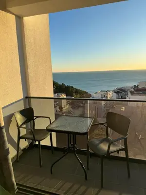 a table and two chairs on a balcony with the ocean at Luxury Ocean View in Ulcinj