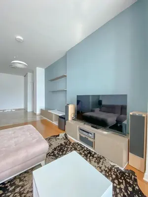 a living room with a large flat screen tv at Apartment in Tre Canne in Budva