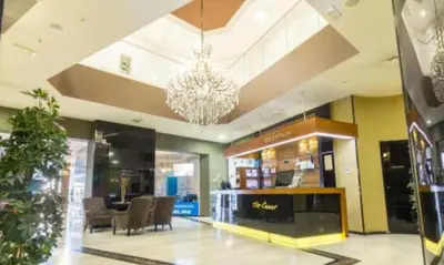 a large lobby with a chandelier in a store at Apartment in Tre Canne in Budva
