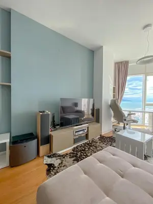 a bedroom with a large bed and a room with a view at Apartment in Tre Canne in Budva