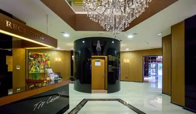 a lobby of a store with a chandelier at Apartment in Tre Canne in Budva