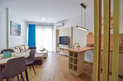 a living room with a couch and a table at Dolami residence in Becici