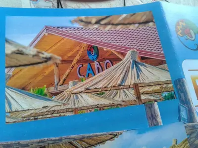 a box with a picture of a caved in house at Apartment Donji Stoj, Ulcinj, rosso in Donji Štoj