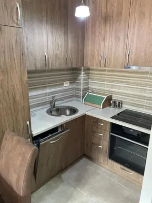 a small kitchen with a sink and a stove at Apartments Moreno in Budva