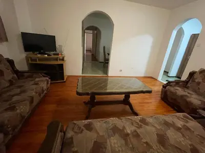 a living room with a coffee table and a tv at Apartments Moreno in Budva