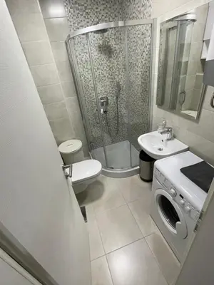 a bathroom with a shower and a toilet and a sink at Apartments Moreno in Budva