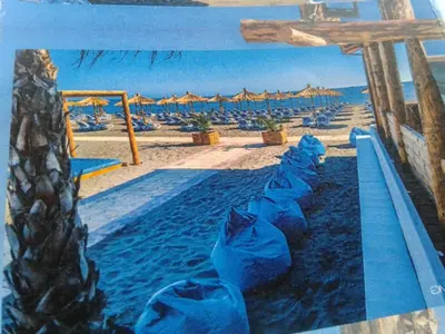 a painting of a swimming pool on the beach at Apartmen Donji Stoj, yellow in Donji Štoj