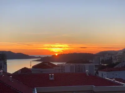 a view of the sunset from a building at Apartment Becici in Becici