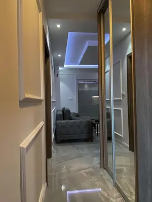 a living room with a couch and a blue ceiling at Masha Apartment in Budva