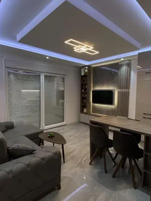 a living room with a couch and a table at Masha Apartment in Budva
