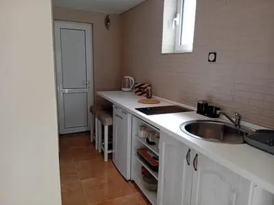 a kitchen with a sink and a counter top at Apartment deluxe Ina FREE PARKING in Budva