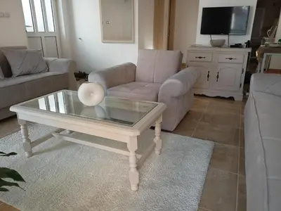 a living room with a coffee table and a couch at Apartment deluxe Ina FREE PARKING in Budva