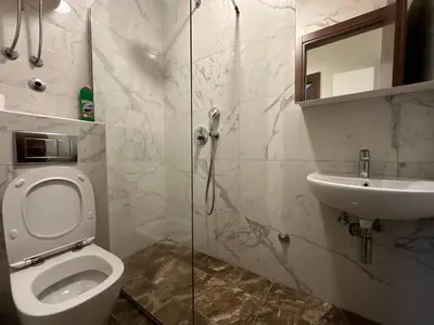 a bathroom with a toilet and a sink at Jovana Apartments 2 in Budva