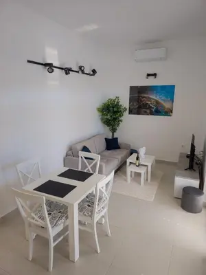 a living room with a table and a couch at Boulevard Apartments in Kotor