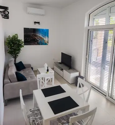 a living room with a couch and a table at Boulevard Apartments in Kotor