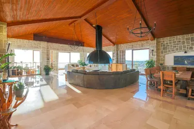 a large kitchen with a large tub in the middle of a room at Villa Carevic with Indoor & Outdoor Pool in Kotor