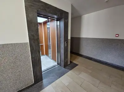 a hallway with a glass door in a room at The Serendipity in Podgorica
