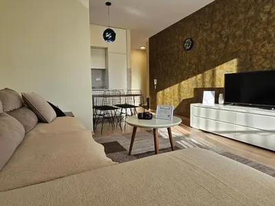 a living room with a couch and a table at The Serendipity in Podgorica