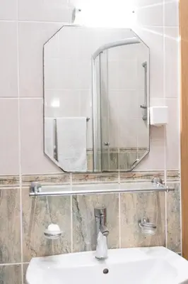 a bathroom with a mirror and a sink at Solaris Summer Resort Apartments in Sutomore